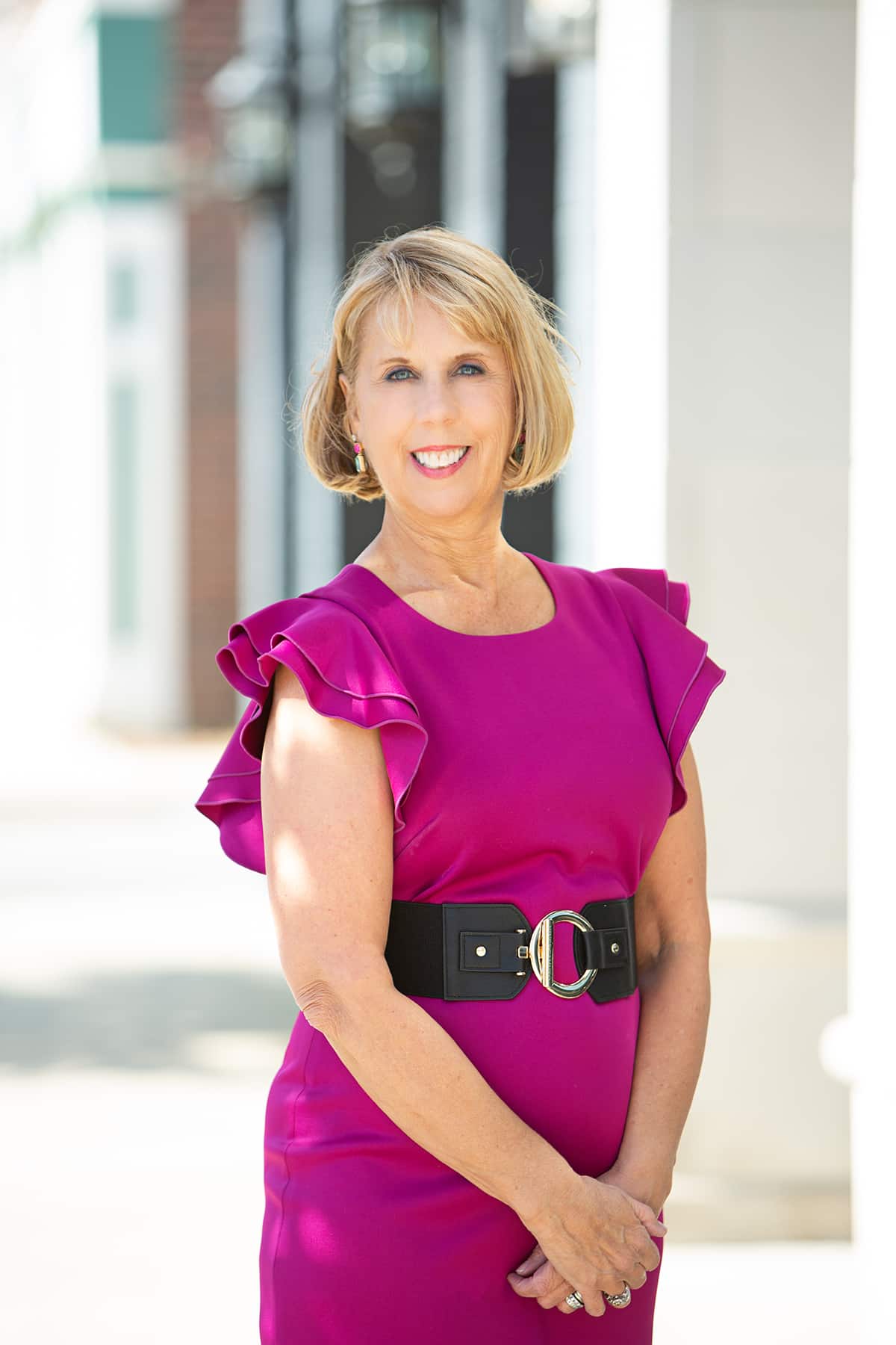 Carmel Stylist standing in front of building