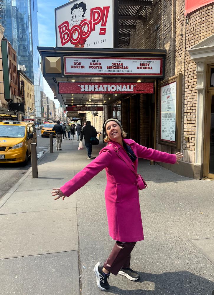 Planning outfits around a versatile color helps when packing for travel according to Personal Image Consultant Beth Divine image shows Beth Divine on Manhattan sidewalk